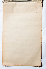 Old, brown, worn paper on white background.