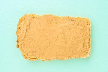 peanut butter sandwich (tasty snack, bread toast buttered with nut butter) menu concept. food background. copy space. Top viev