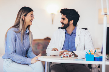 Optometrist checking patient eyesight and vision correction