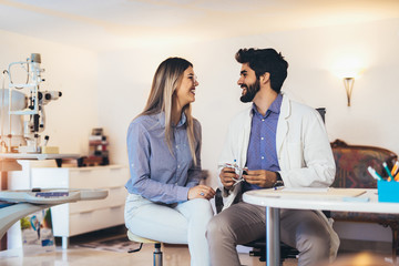 Optometrist checking patient eyesight and vision correction