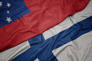 waving colorful flag of finland and national flag of Samoa .