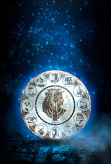 Dark night magic scene. Egyptian Queen Nefertiti silhouette on the background of the old cobblestone road. Blue neon, moonlight at night.