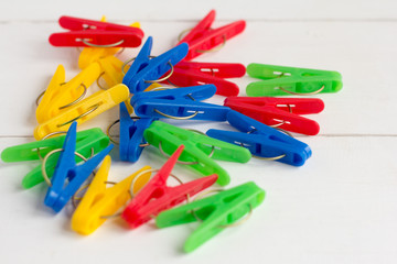 bright colored clothespins lie on the table