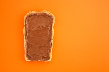 chocolate nut butter sandwich (delicious snack, bread or toast and nut butter, paste, classic combination of taste, Italian cuisine) menu concept. food background. copy space. Top view