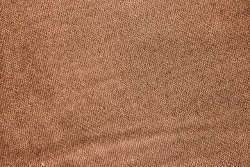 Fototapeta na wymiar Texture of a brown stretch denim fabric