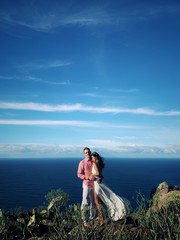 Happy couple just married at the oceanside