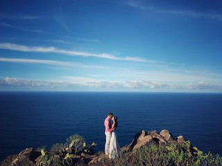 Happy couple just married at the oceanside