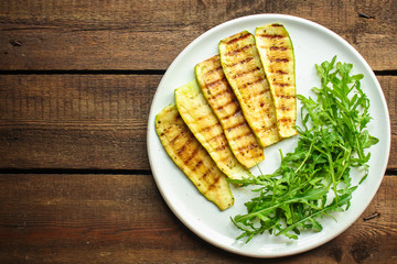 grilled zucchini (fried vegetables and salad, main course, healthy food) menu concept. food background. copy space. Top view