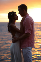 Happy couple just married at the oceanside