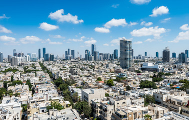 Fototapeta premium Aerial view of Tel Aviv City with modern skylines against the blue sky in the downtown of Tel Aviv, Israel.