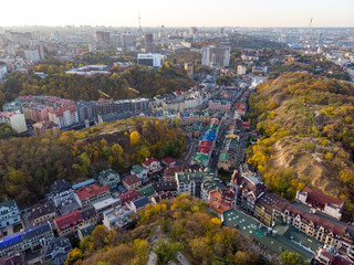 Aerial top view of Kyiv cityscape of Vozdvizhenka and Podol historical districts on sunset from above, city of Kiev, Ukraine