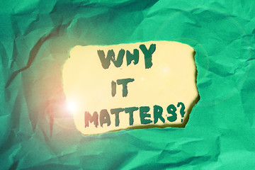 Writing note showing Why It Matters question. Business concept for ask demonstrating about something he think is important Green crumpled colored paper sheet torn colorful background