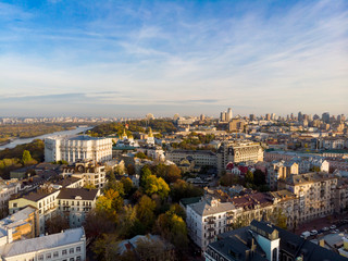 Aerial top view of Kyiv cityscape, Dnieper river and Podol historical district skyline from above, Kontraktova square with ferris wheel, city of Kiev, Ukraine