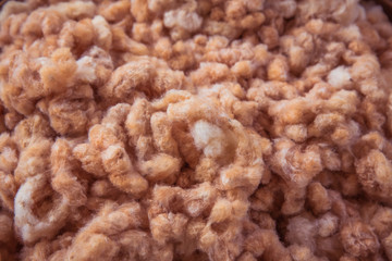 Raw cotton. Cotton group material raw. Organic brown cotton background.