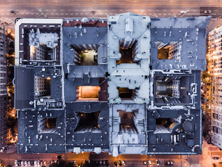 We live in here, aerial top down view of old houses squre in Warsaw city center at dusk