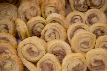 Sweet puff pastry rolls on the buffet line