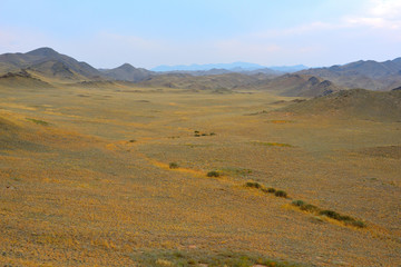 Mountains with yellow grass on autumn in Kegen region of Kazakhstan