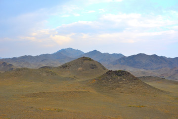 Mountains with yellow grass on autumn in Kegen region of Kazakhstan