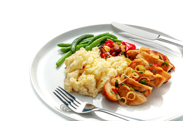 Roasted chicken breast fillet with mashed potato, green beans and vegetable sauce isolated on white background. Close-up studio shot.