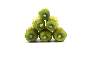 Several organic small cucumbers isolated over white background.
