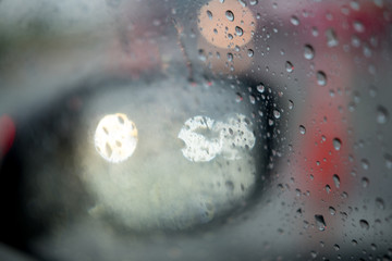 Blurred rain drop on the car glass background