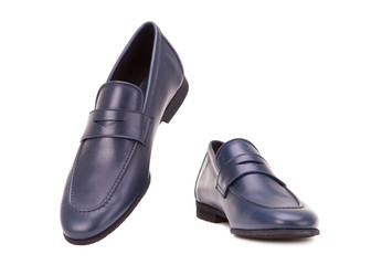 Blue male loafers isolate on a white background. Blue male loafers isolate on a white background. Walking pair of shoes.