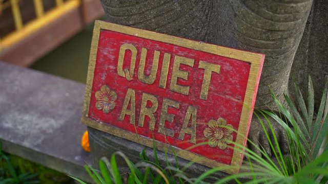 Slowmotion closeup shot of the Quet area sign in a tropical spa