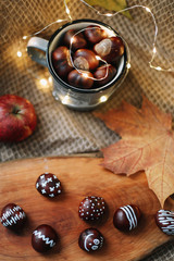 Obraz na płótnie Canvas Fresh sweet chestnuts. Autumn still life. halloween, thanksgiving day background. Cozy warm image, hygge style