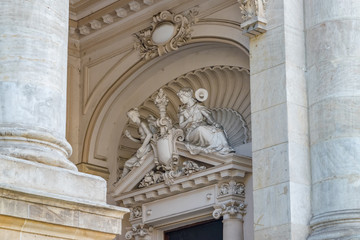 National Museum of Romanian History building in Bucharest, Romania. National Museum of Romanian History on a sunny summer day with a blue sky. Statue detail