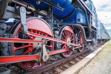 Historic train, detail of steam locomotive wheels.