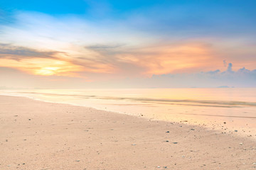 Fototapeta na wymiar Beautiful colorful sunrise at the calmness beach