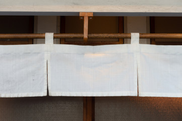 The curtain-like fabric that hangs in front of traditional Japanese restaurants and shops not only serves as a signboard, but holds a larger meaning,