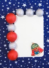 New Year white card on a blue background with white stars and toys balls for the Christmas tree