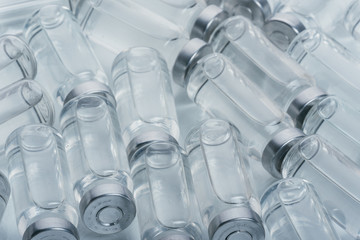 Glass medical ampoule vial for injection. Medicine is dry white drug penicillin powder or liquid...