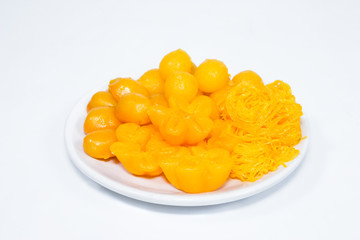 egg yoke fudge balls cooked in syrup on background