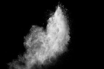 abstract white powder splatter on black background,Freeze motion of white powder exploding.