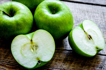 summer food with green apples on wooden background