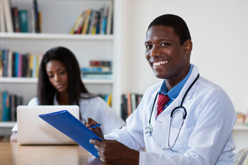 Laughing african american doctor with nurse