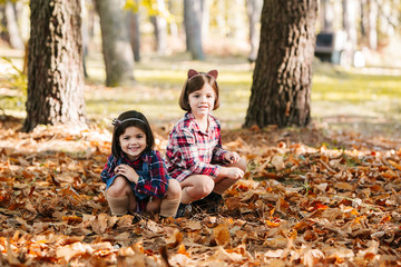 Sisters enjoy at park in autumn