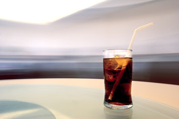 Cola in glass with motion background
