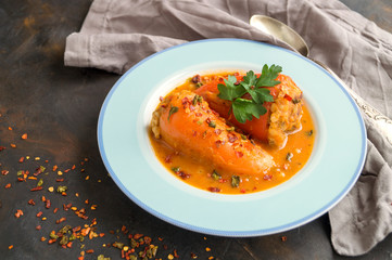 Peppers stuffed with minced meat in tomato sauce.