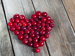 Cherry heart shape on a wooden rustic background