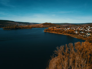 Aerial drone shot of beautiful lake and village