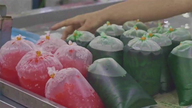Red And Green Grass Jelly Drinks In Traditional In Malaysia - Hand Held 