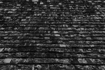 Black and white background image, old roof tile