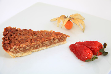 A slice of pecan pie with decoration