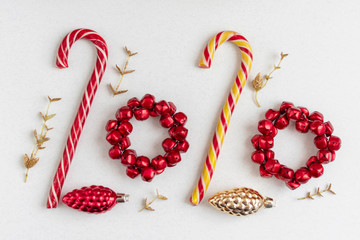 2020 of Christmas candies and toys. Minimal creative new year concept.