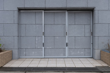 sidewalk by street wall & door