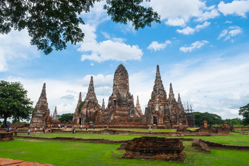 Fototapeta premium Wat Chaiwatthanaram is an old temple in the Ayutthaya period. There are people walking the ruins and ancient traces.