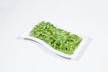 Green bean with dish on background.